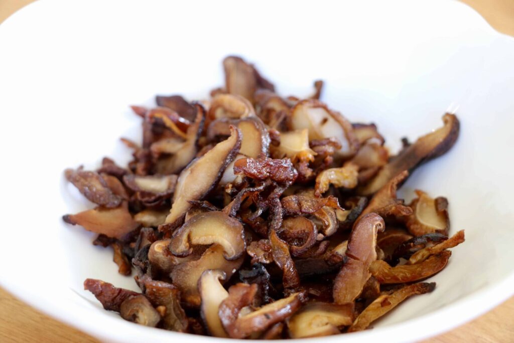 Shiitake Bacon served in a white bowl