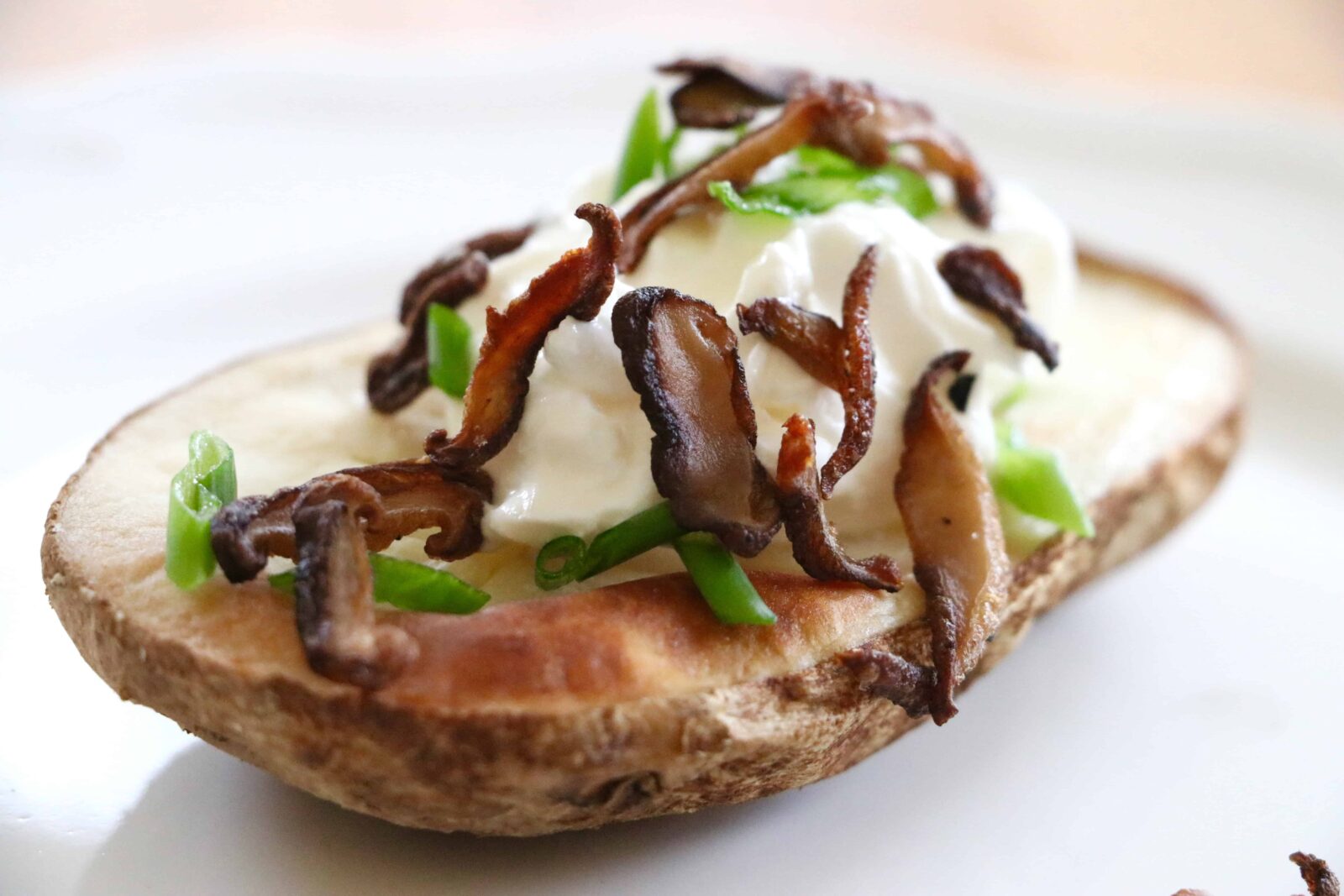 Shiitake Bacon served on a baked potato