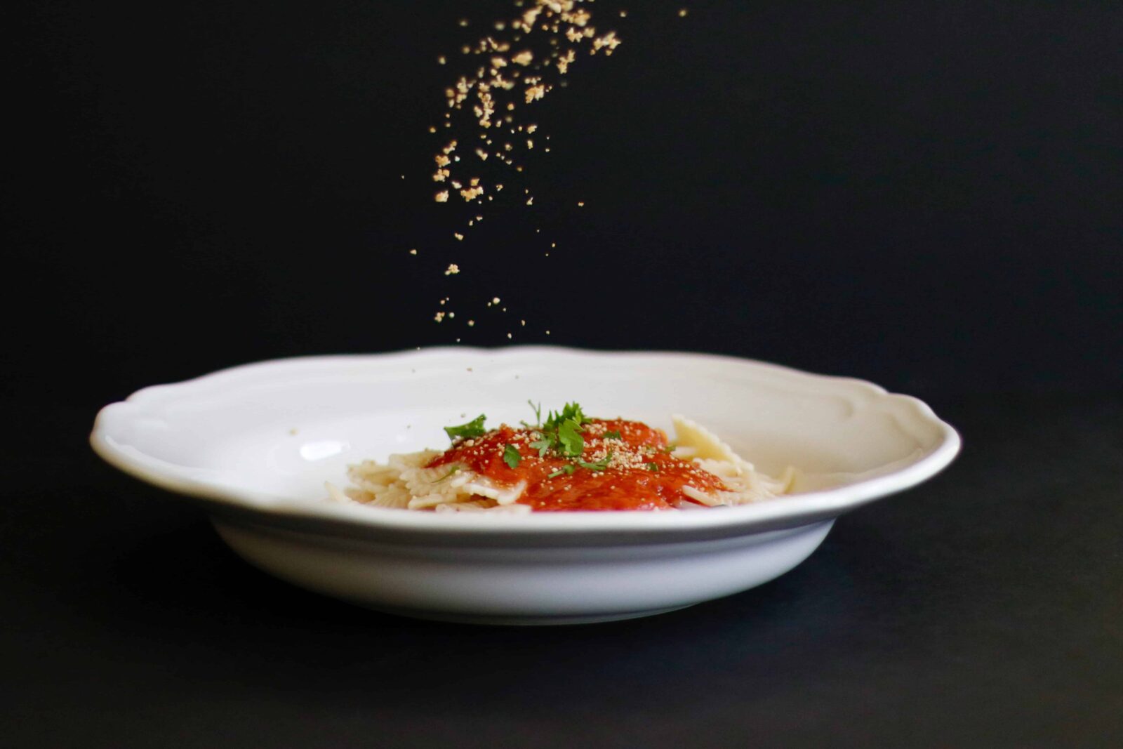 Vegan Parmesan sprinkled on pasta