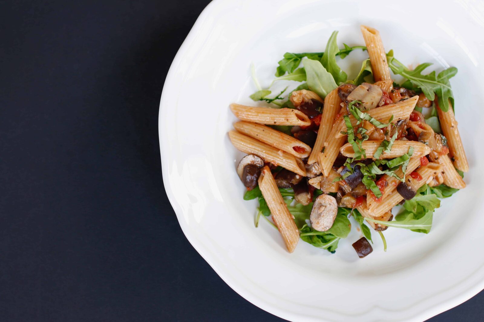 One-pot Eggplant And Mushroom Pasta served in a white bowl