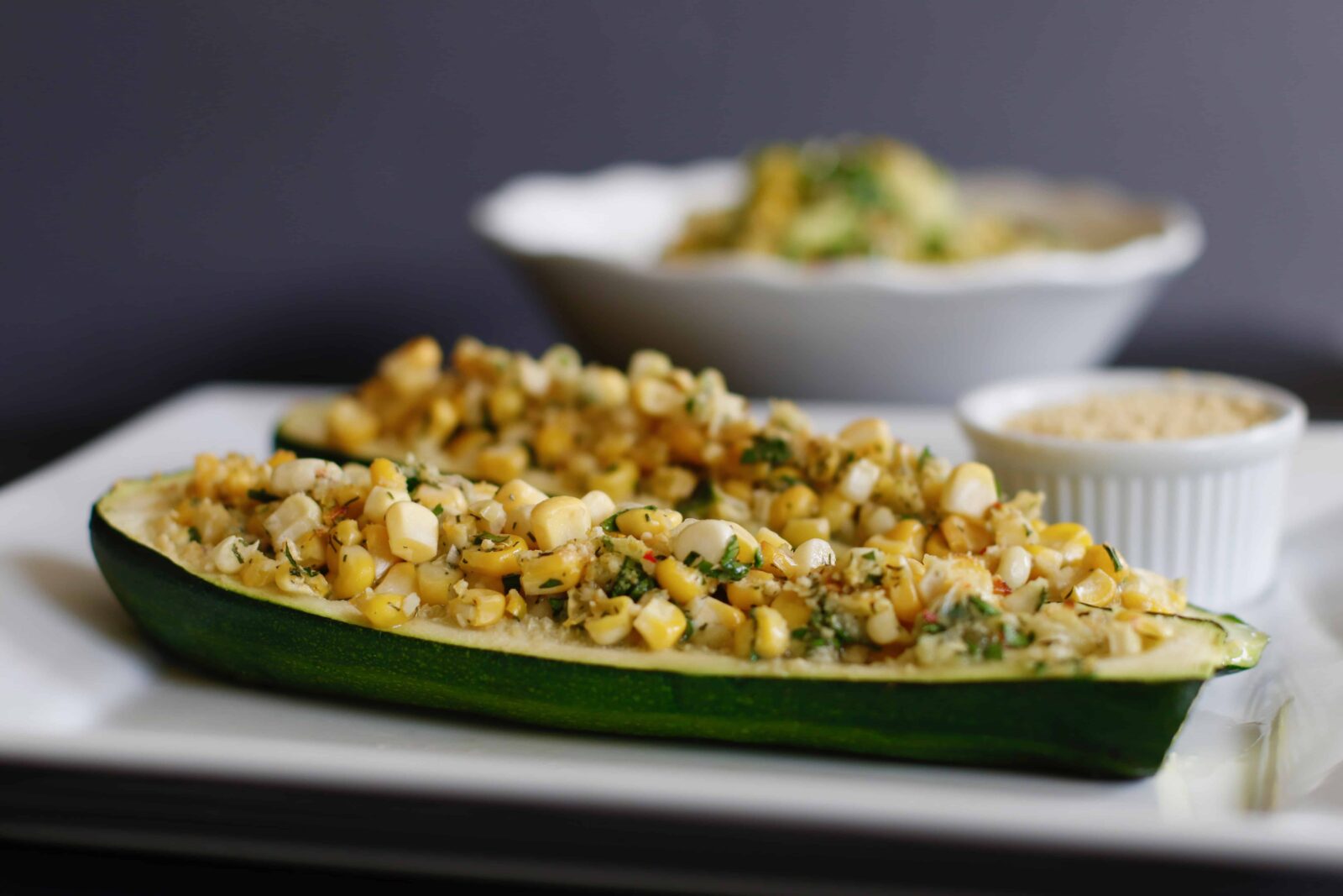 Stuffed Zucchini Boats served on a white plate