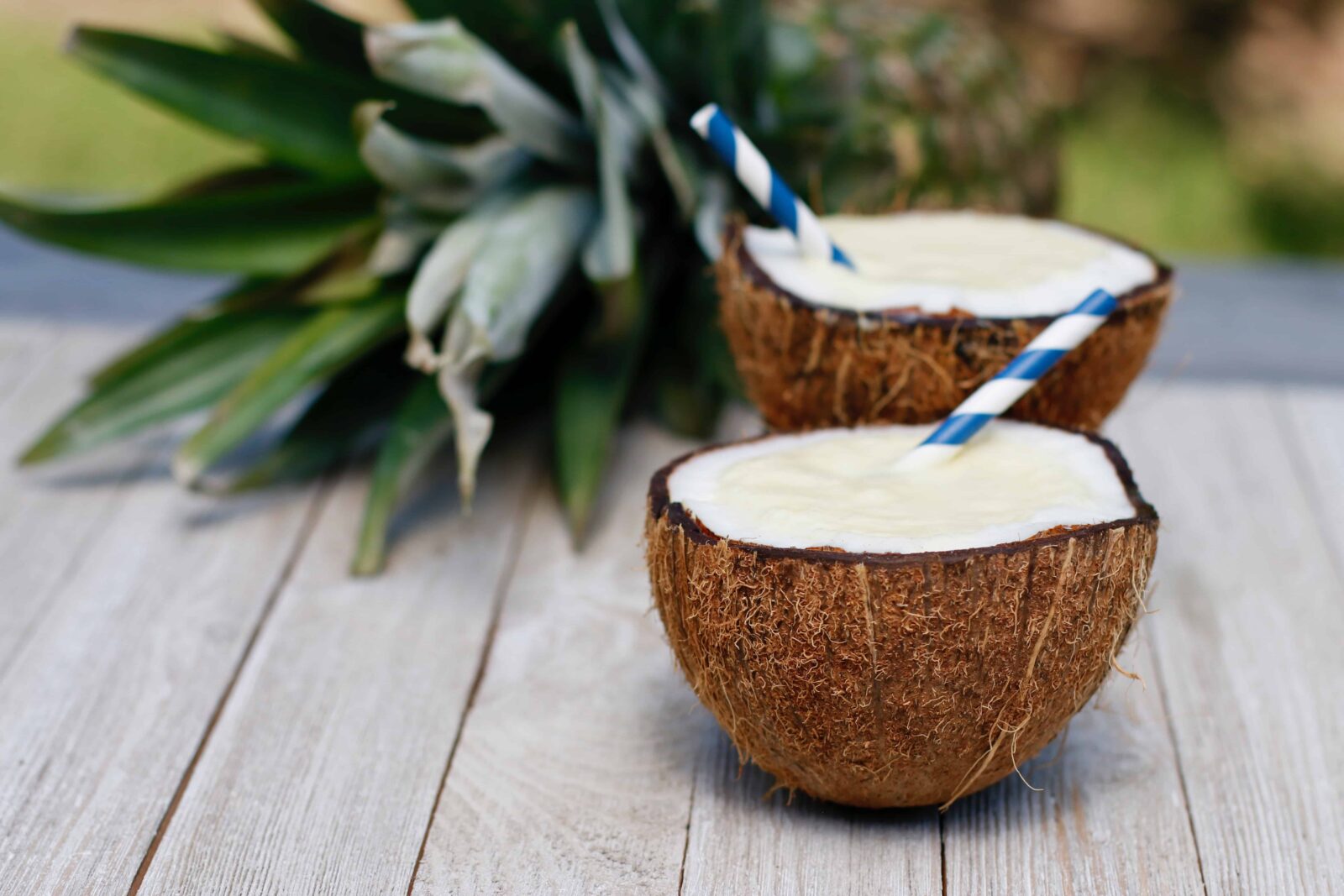 Virgin Piña Coladas served in coconut shells