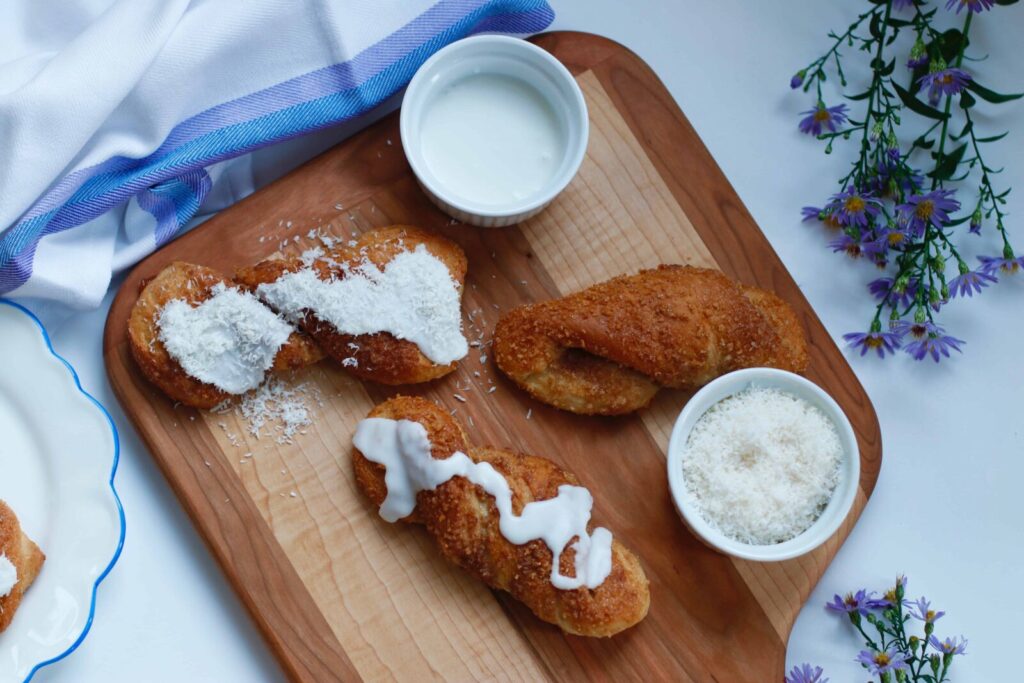 Sweet Rolls served with icing and shredded coconut