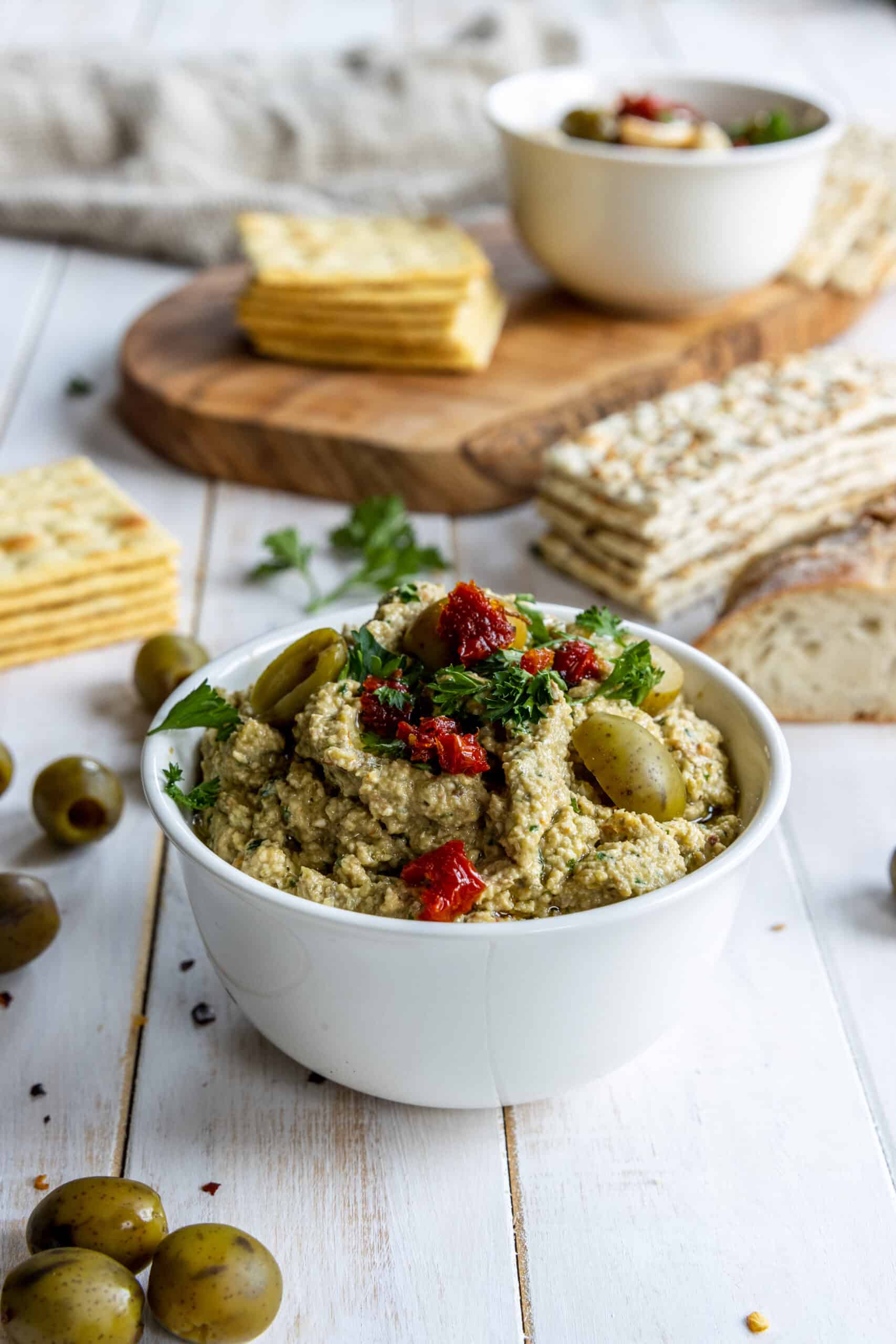 Green or Black Olive Tapenade served in a bowl with Crackers