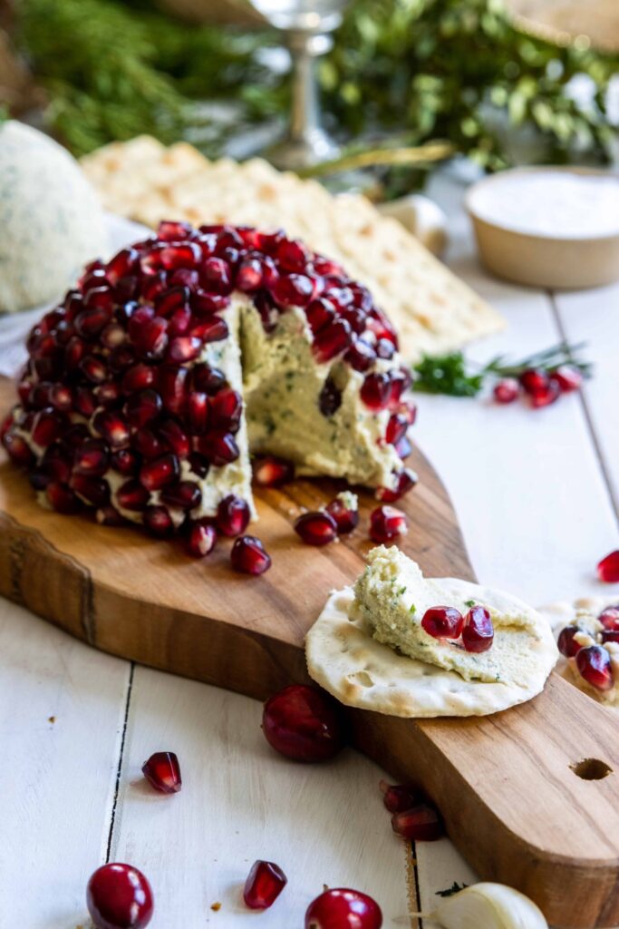 Vegan Roasted Garlic & Herb Cheesy Spreadable Dip | Holiday Appetizer served on a cracker