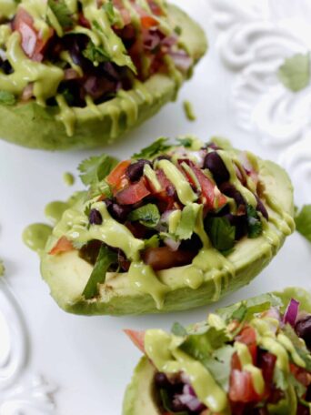 Stuffed Avocados with Dressing served on a white platter
