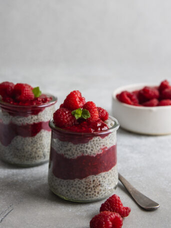 Chia Seed pudding served with raspberry jam and fresh raspberries