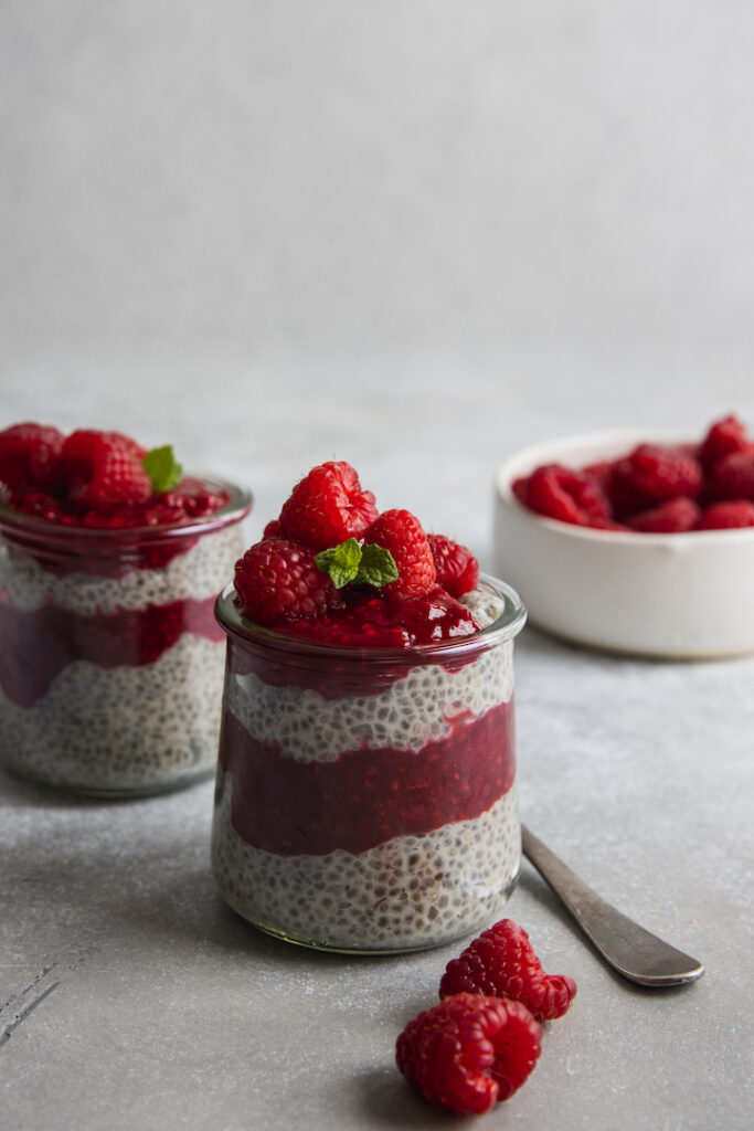 Chia Seed pudding served with raspberry jam and fresh raspberries