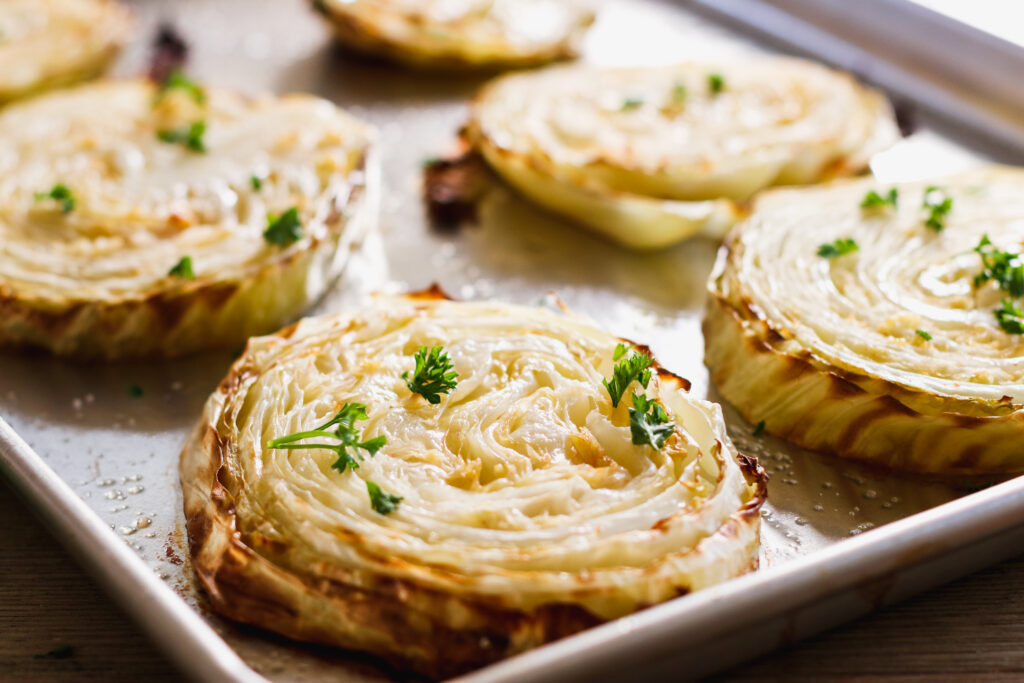 Cabbage Steaks on a baking sheet tray