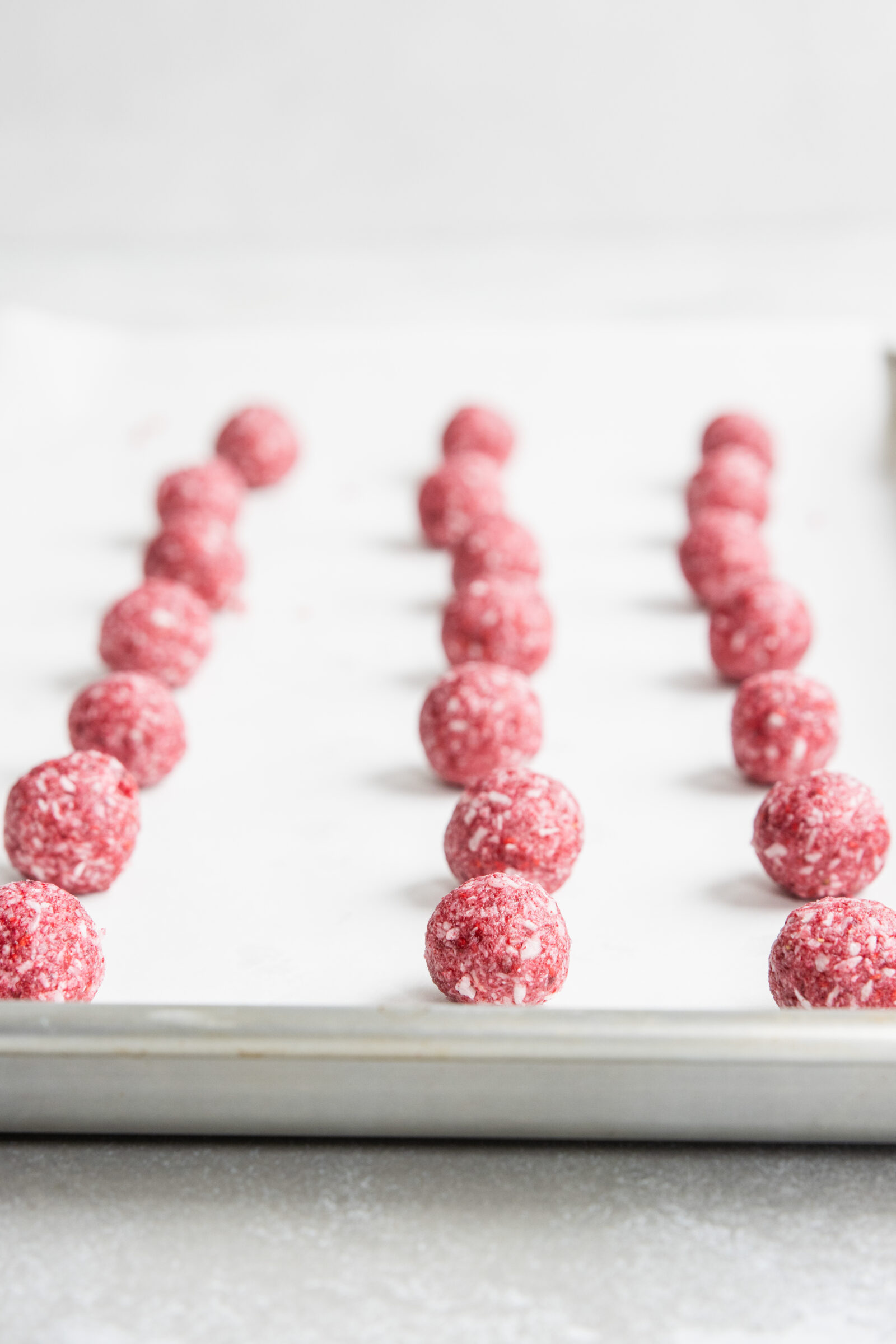 Vegan raspberry truffles ready to chill in the fridge