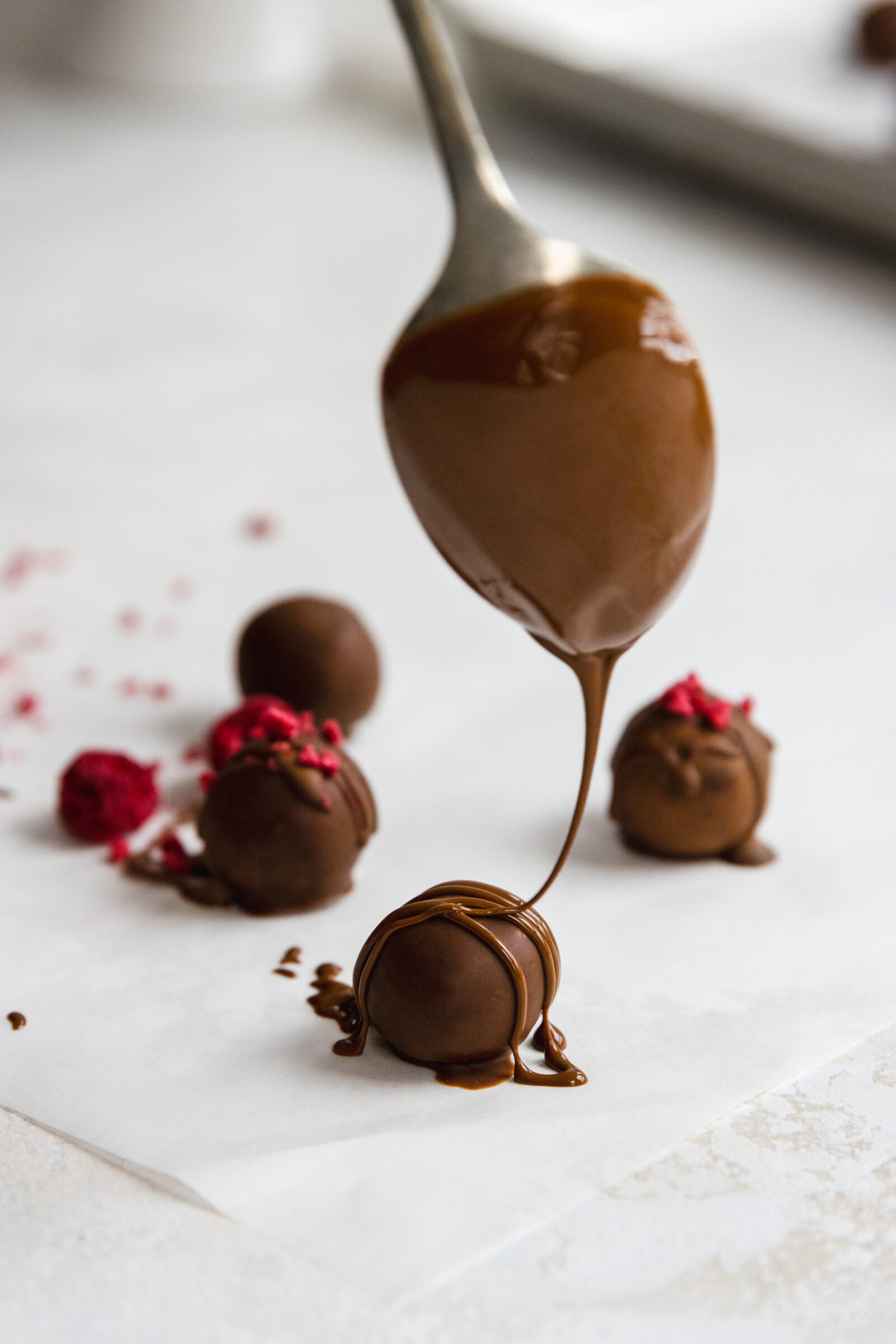 Vegan raspberry Truffles drizzled in carob