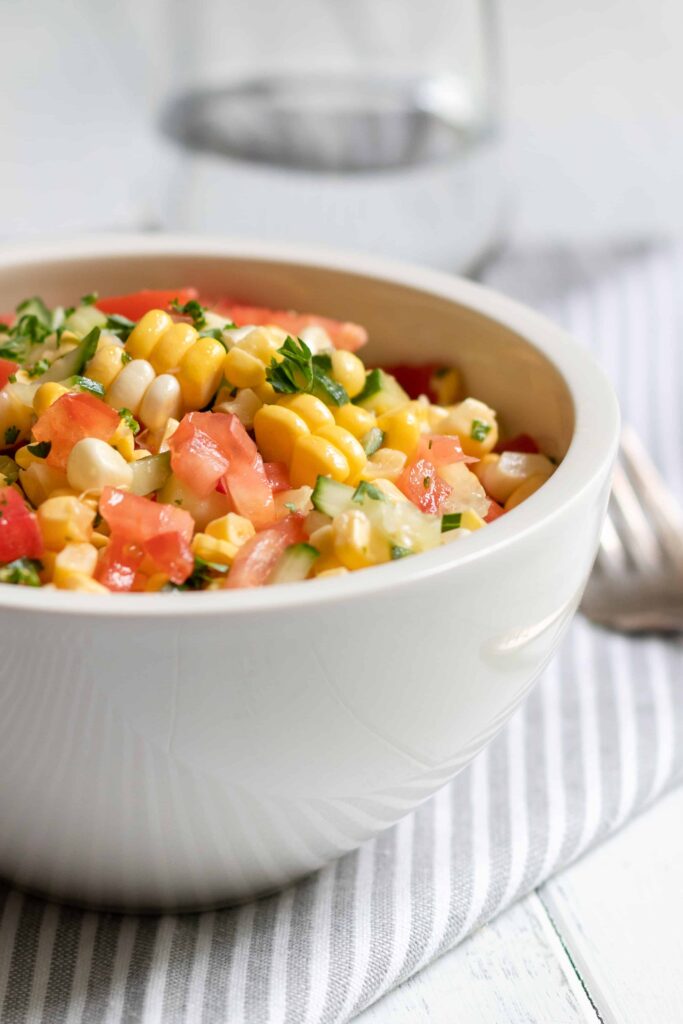 Fresh Corn Salad served in a white bowl