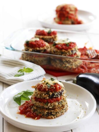 Vegan Eggplant Parmesan served on a white plate