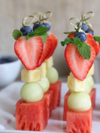 Fruit Kabobs served on a white plate