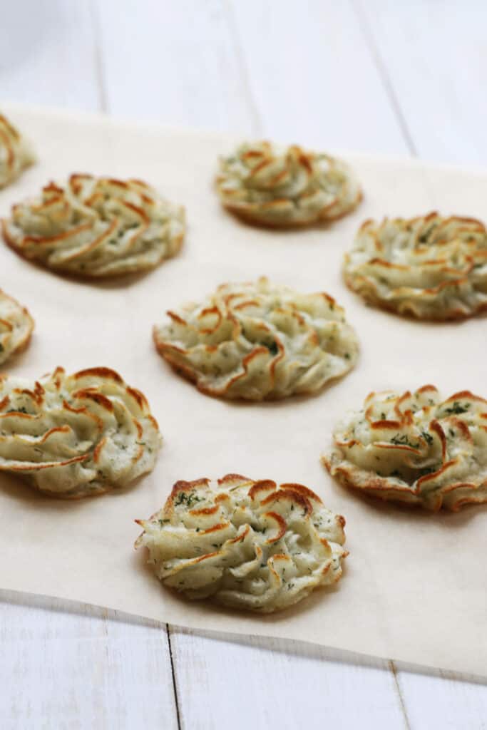 Simple Vegan Duchess Potatoes with Herbs on a piece if parchment paper