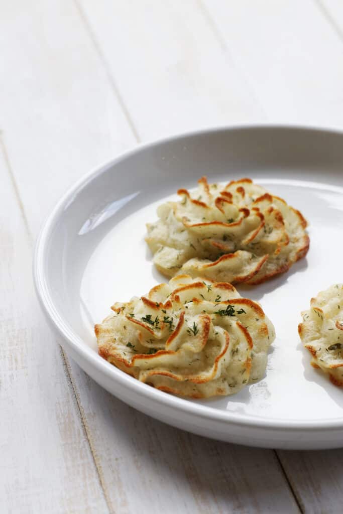 Simple Vegan Duchess Potatoes with Herbs on a plate