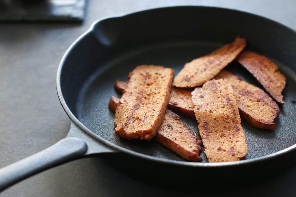 Vegan bacon served in a cast iron pan