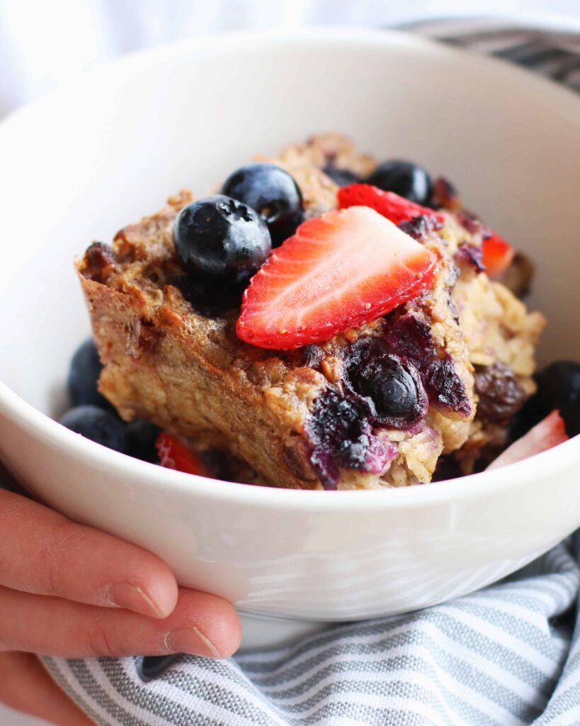 Vegan Overnight Baked Oats served with fresh blueberries and strawberries 