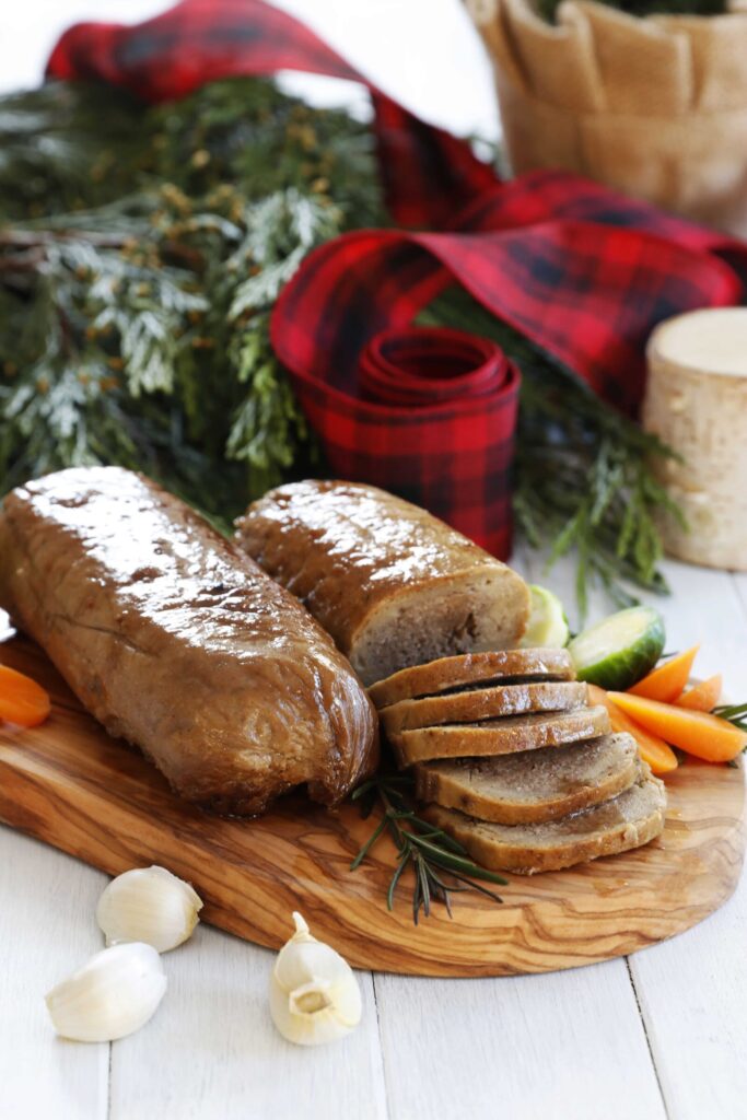 Gluten-Free Vegan Holiday Roast with Mushroom Filling Served on a Platter