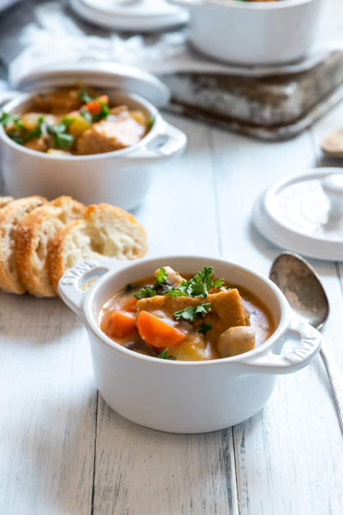 Vegan beef stew served with fresh parsley 