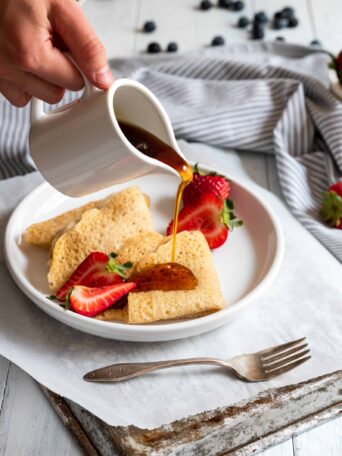 Vegan Crepes served with fresh strawberries and maple syrup
