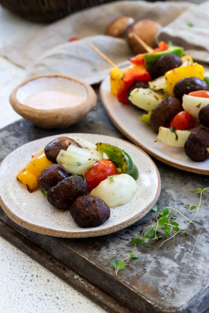 Grilled Mushrooms, onion, pepper, and cherry tomatoes on a plate