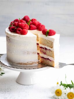 Vegan Lemon Raspberry Cake being cut and served