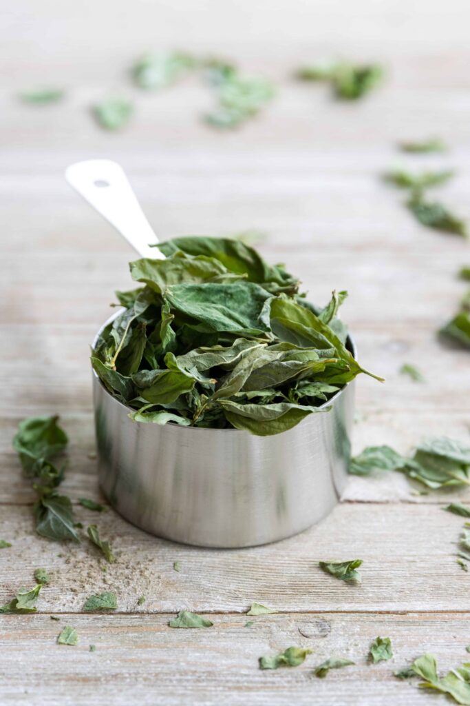 Freeze Dried Basil in a Measuring Cup