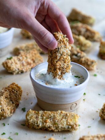 Zucchini Stick dipped in Vegan Ranch Dressing