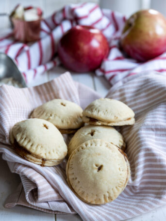 Apple Hand Pies placed in a pink towel
