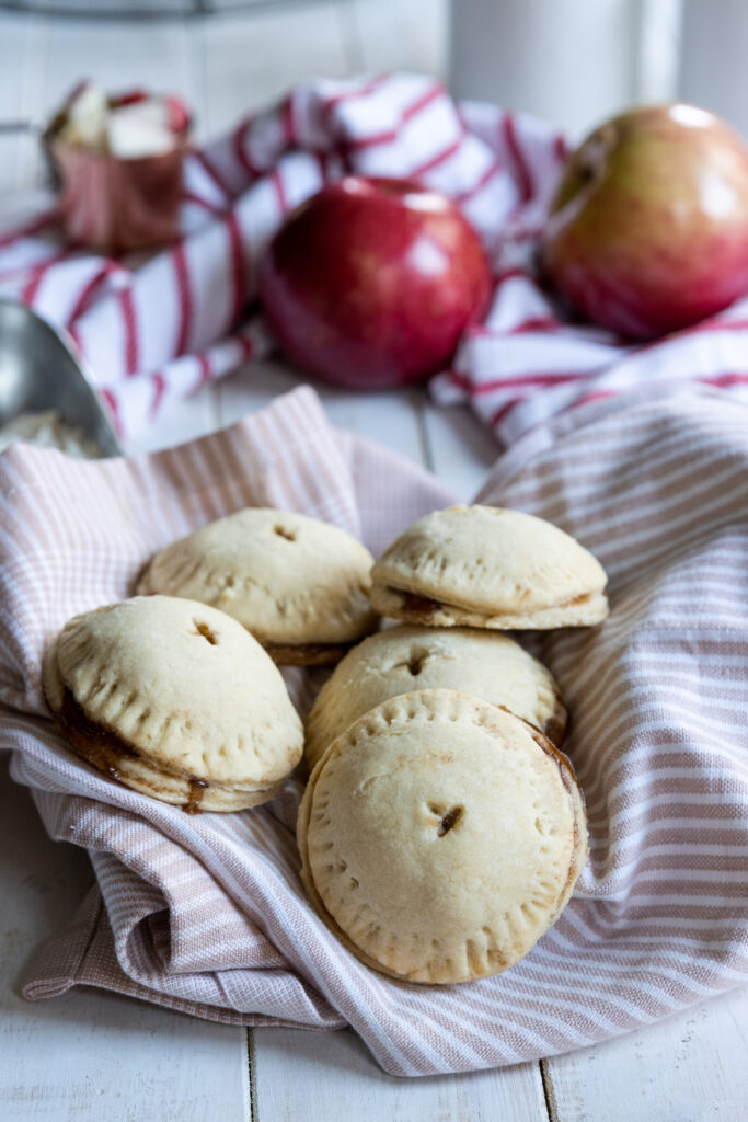 Apple Hand Pies placed in a pink towel