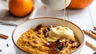Pumpkin Steel Cut Oats in a bowl with Maple Syrup