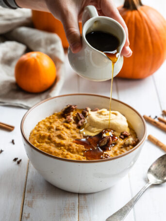 Pumpkin Steel Cut Oats in a bowl with Maple Syrup