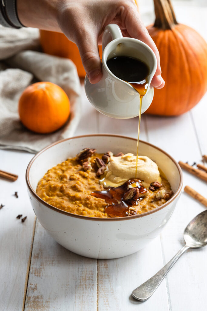 Pumpkin Oatmeal in a bowl with Maple Syrup