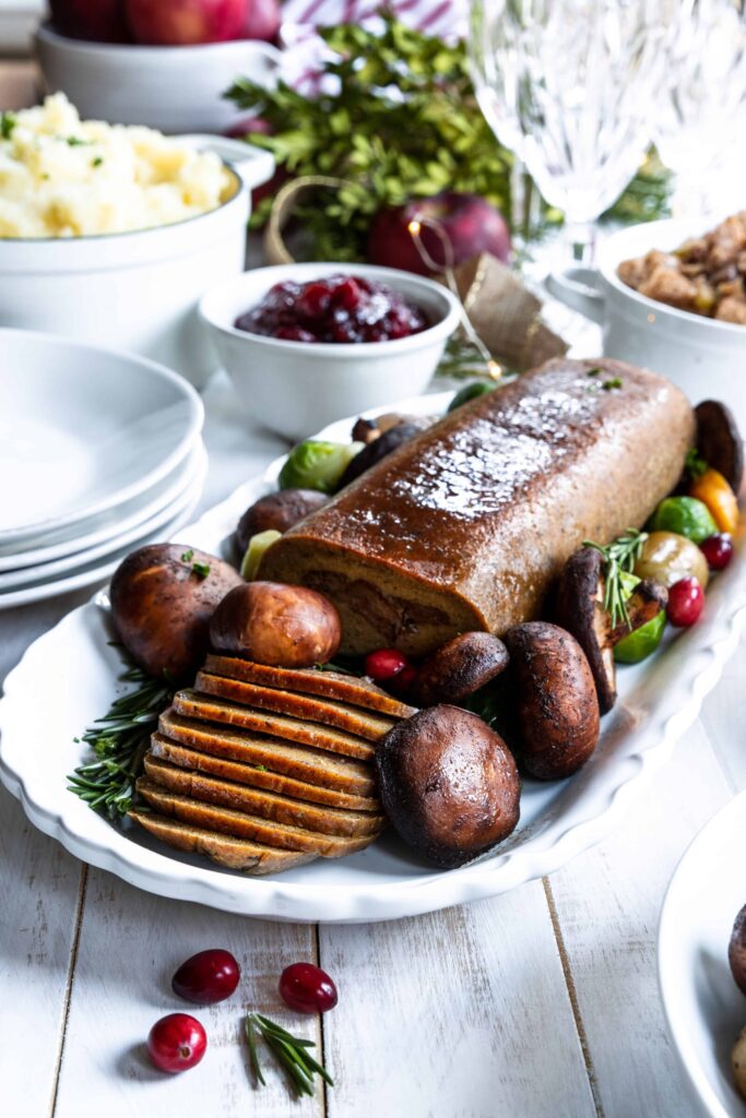 Holiday Roast served on a plate with Mushrooms, Mashed Potatoes, and Stuffing