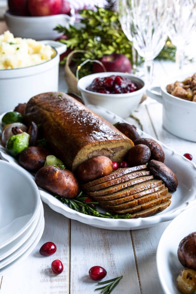 Holiday Roast served on a plate with mashed potatoes and cranberry sauce