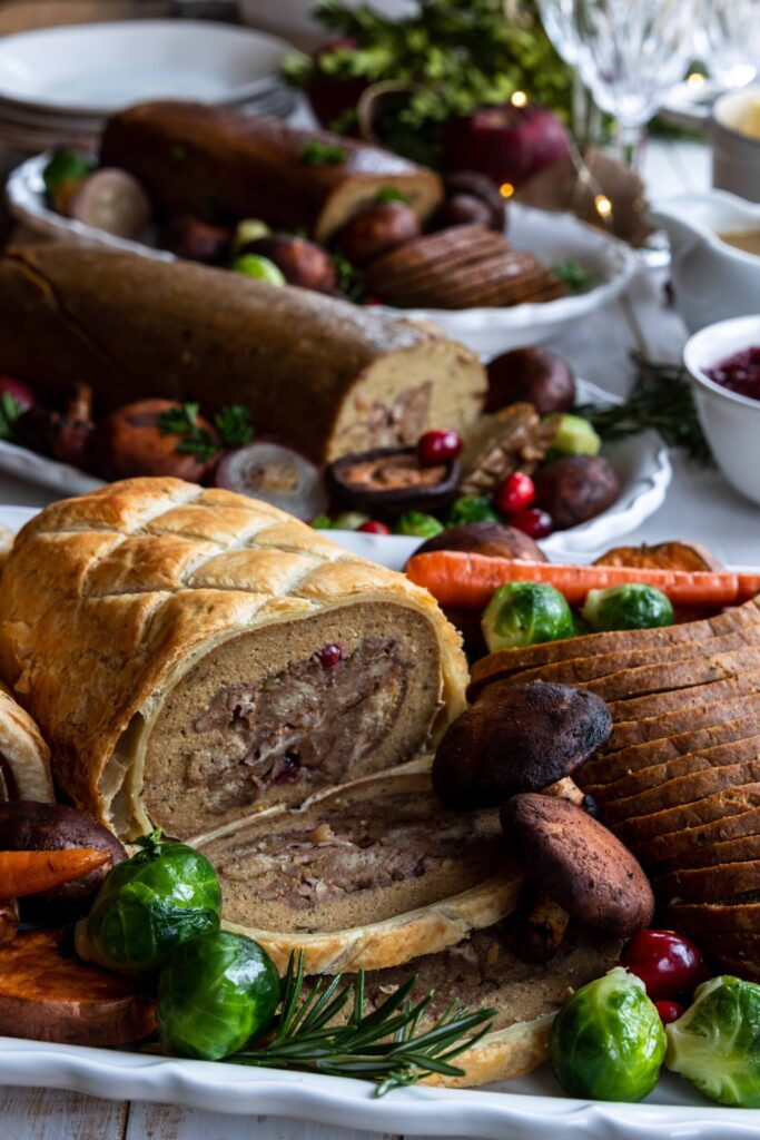 Holiday Roast with Stuffing on a serving plate with mushrooms