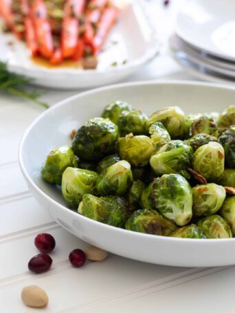 Roasted Garlicky Brussel Sprouts in a white Bowl