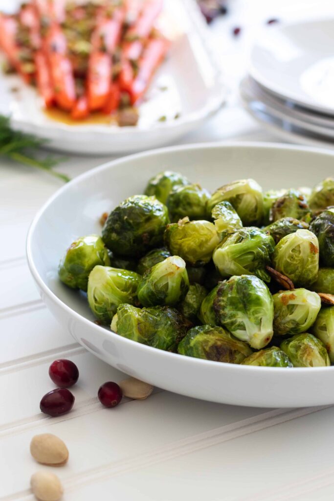 Roasted Garlicky Brussel Sprouts in a white Bowl