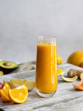 Immune Boosting Smoothie served in a glass with oranges