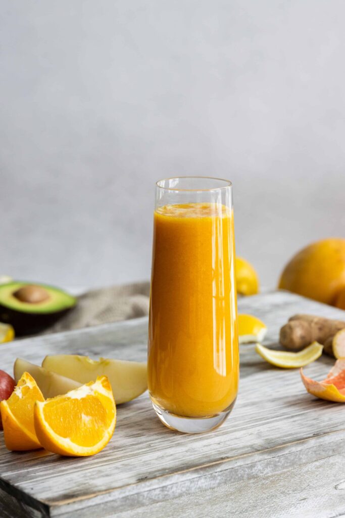 Immune Boosting Smoothie served in a glass with oranges