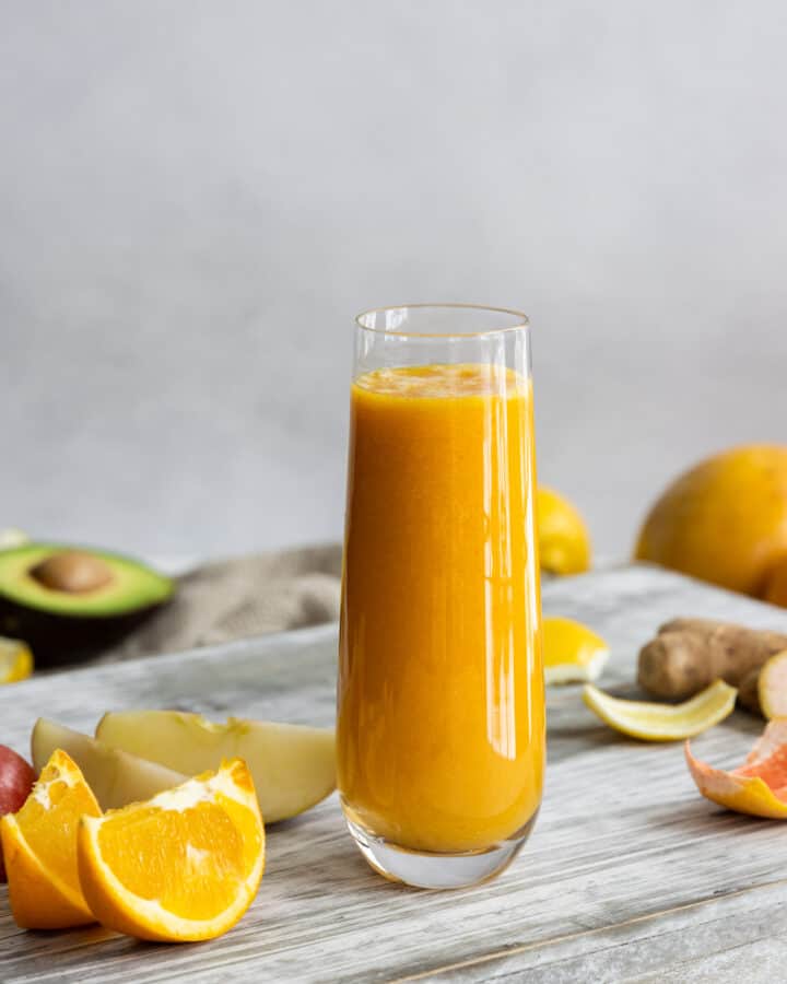 Immune Boosting Smoothie served in a glass with oranges