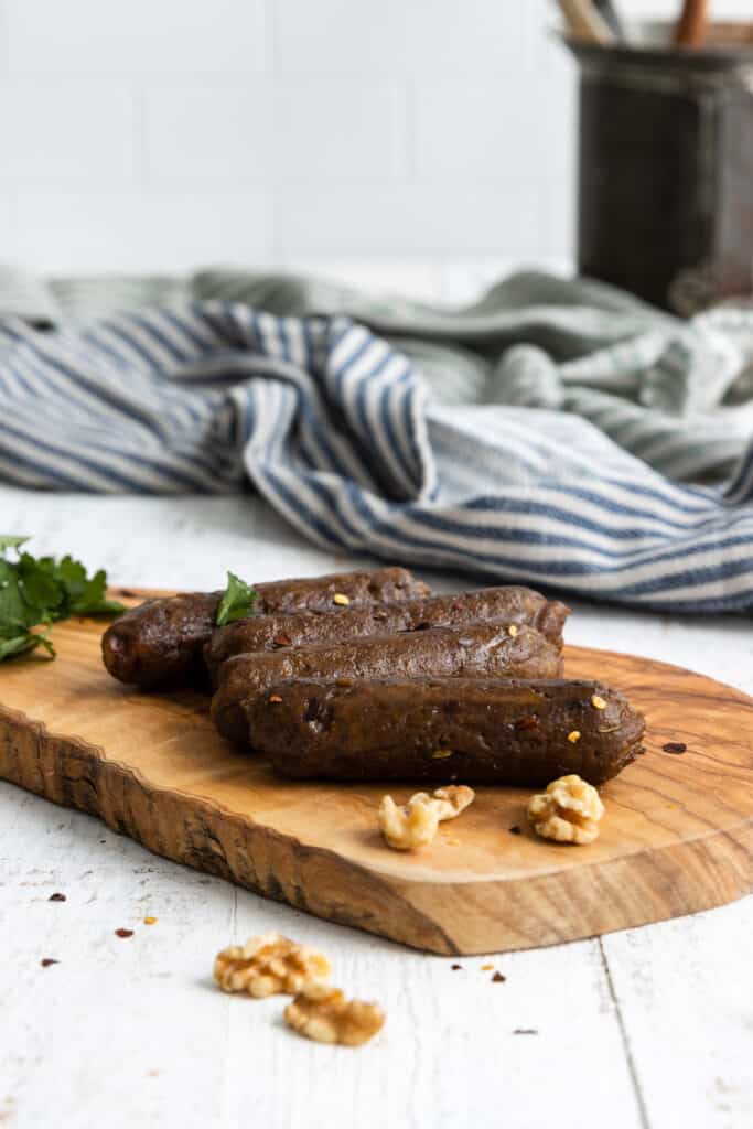 Easy Vegan Spicy Sausages on a Wood Serving Plate