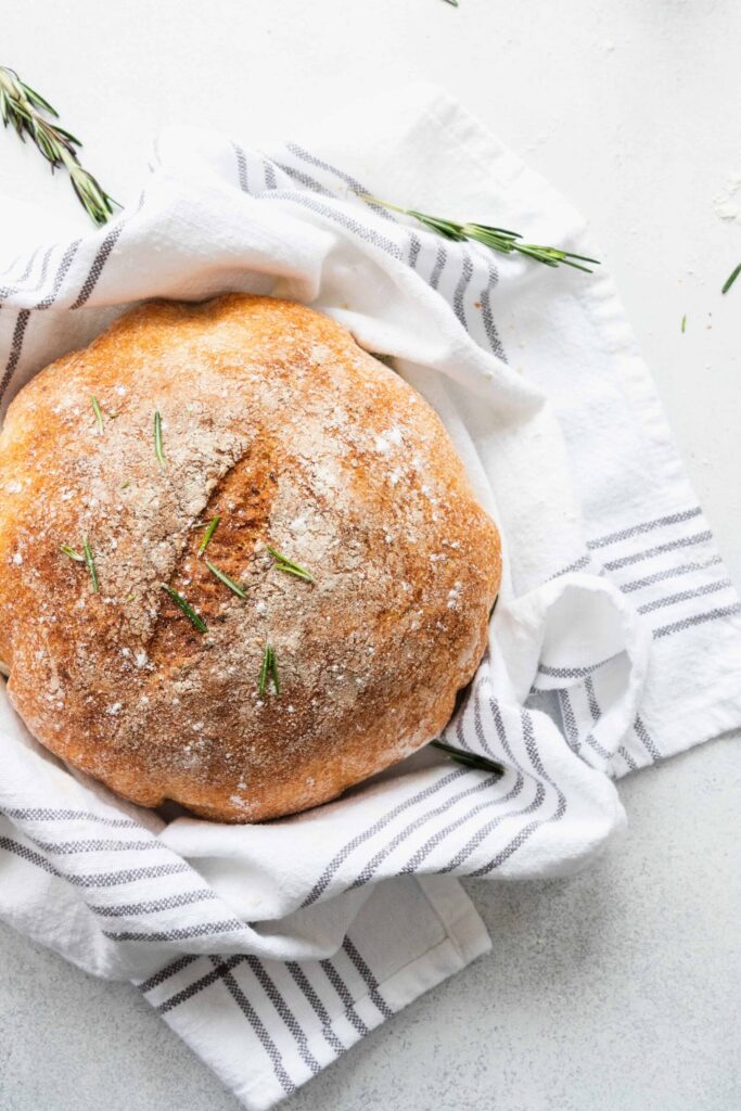 Roasted Garlic & Fresh Rosemary Bread on a White Kitchen Towel