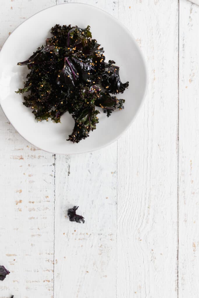 Sesame Red Kale Salad served on a white plate