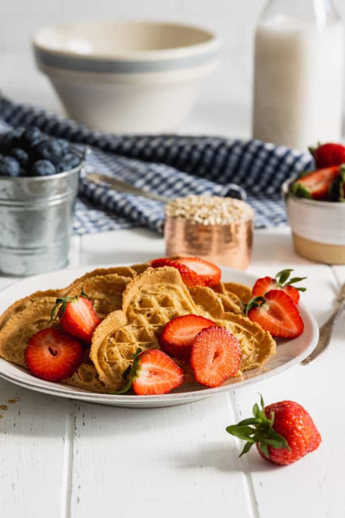 Oat Waffles with strawberries on a white plate