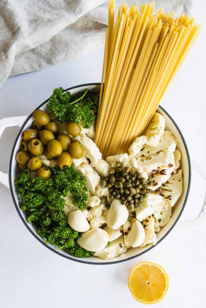 One-Pot Linguine Pasta with Cauliflower, Lemon, and Olives in a Pot Before Cooking