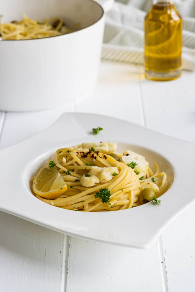 One-Pot Linguine Pasta with Cauliflower, Lemon, and Olives served on a white plate