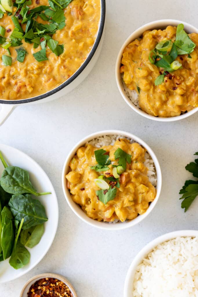 Chickpea Coconut Curry served with fresh spinach and green onion