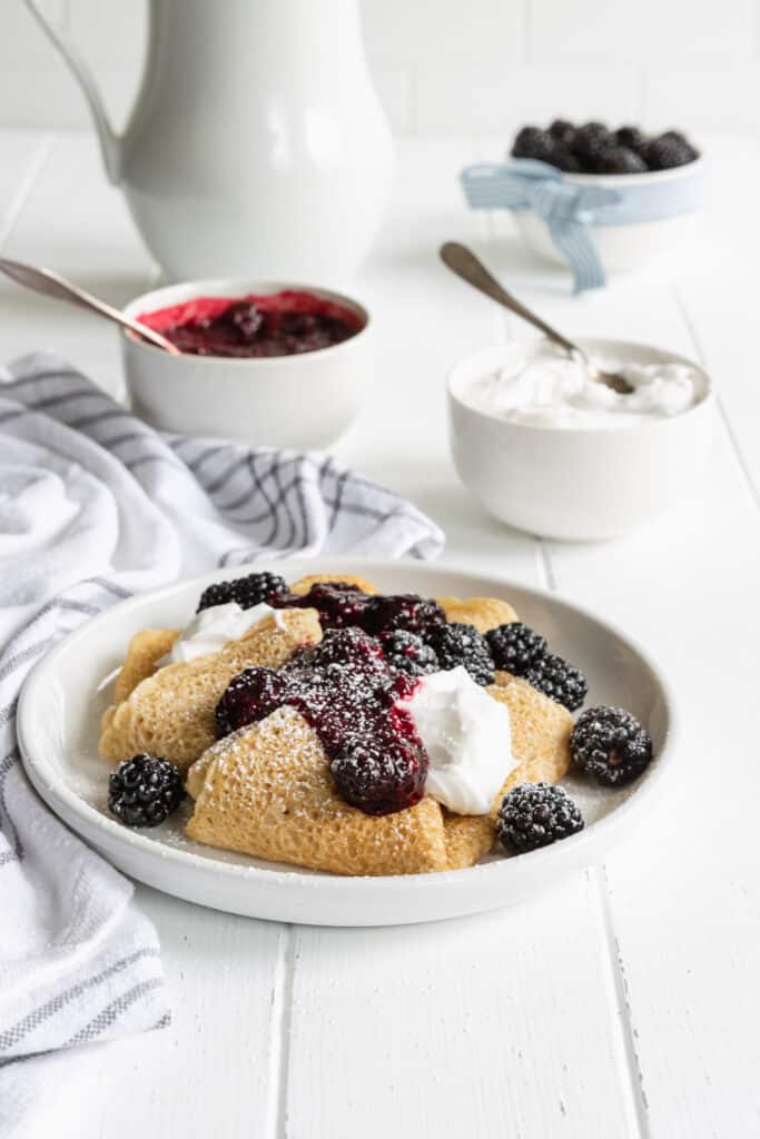 Crepes with Lemon Cream Cheese and Blackberry Filling Dusted in Powdered Sugar